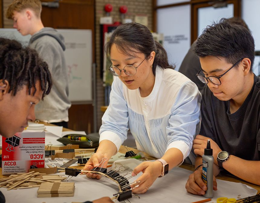 Participants work on building a bridge during a summer program in July 2023