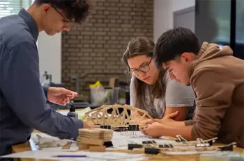 high school students work on models of bridges at Illinois Tech summer program