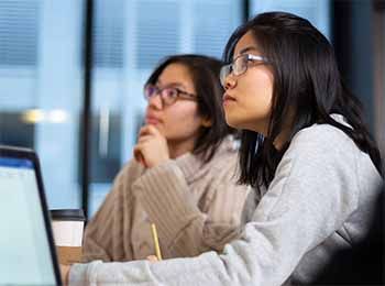 Stuart graduate students working in a group