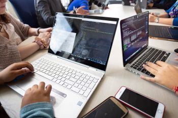 Illinois Tech students work on code