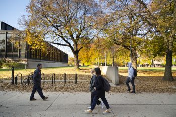 Illinois Tech students walk on campus near Paul V. Galvin Library