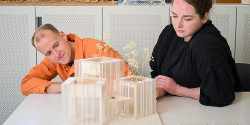 Illinois Tech architecture students work on a model at S. R. Crown Hall