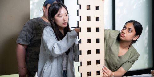 Illinois Tech architecture students work on a model