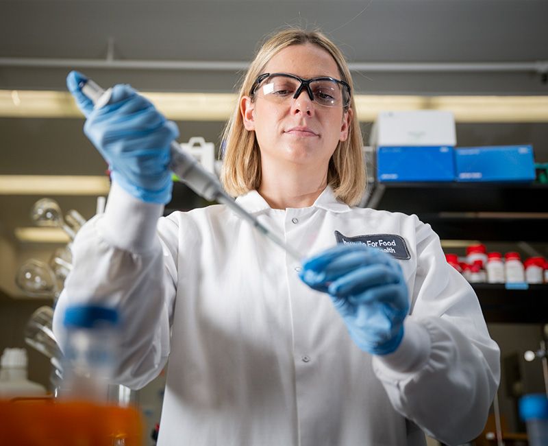 Illinois Tech alumna Catherine Felice works in a lab at the Institute for Food Safety and Health